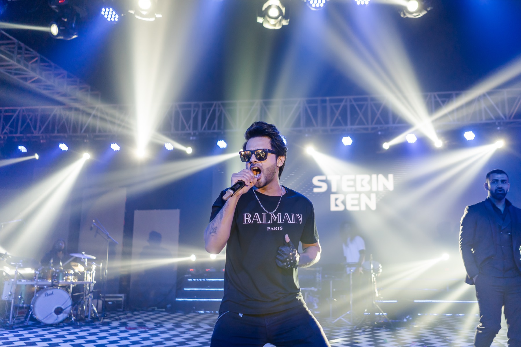 A live singer performing on a concert stage
