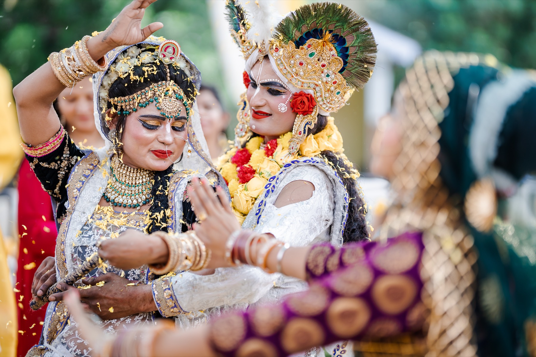 Performers dressed as Radha and Krishna at the sangeet