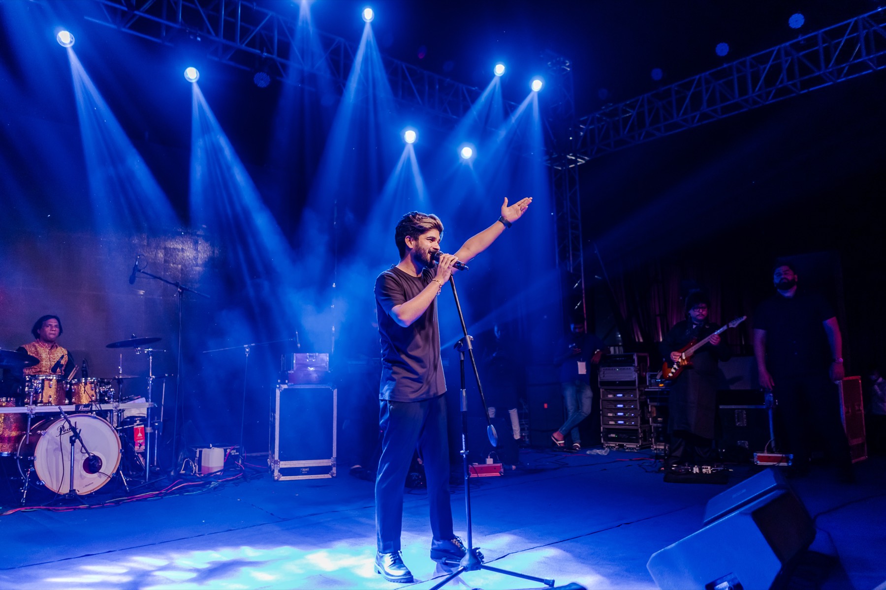 A singer under blue stage lights