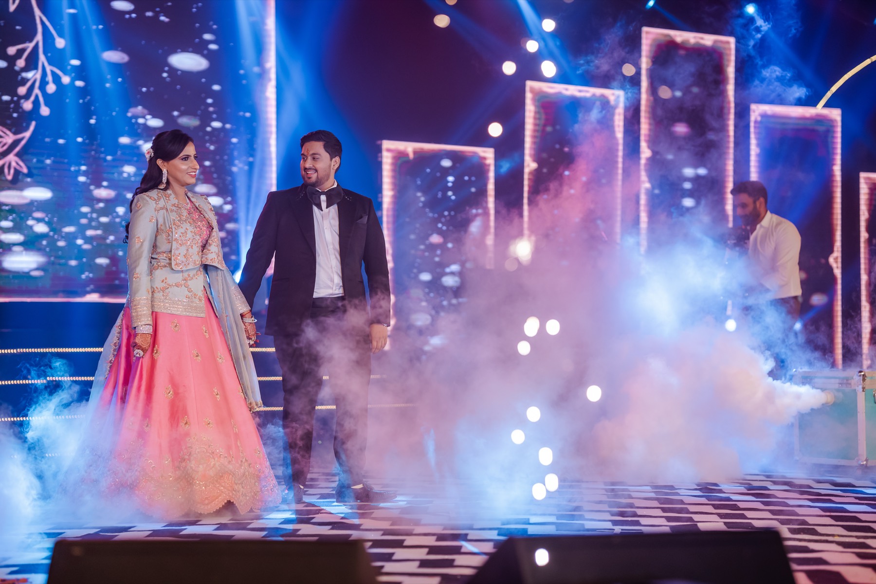 Couple making a sparkler entrance on stage